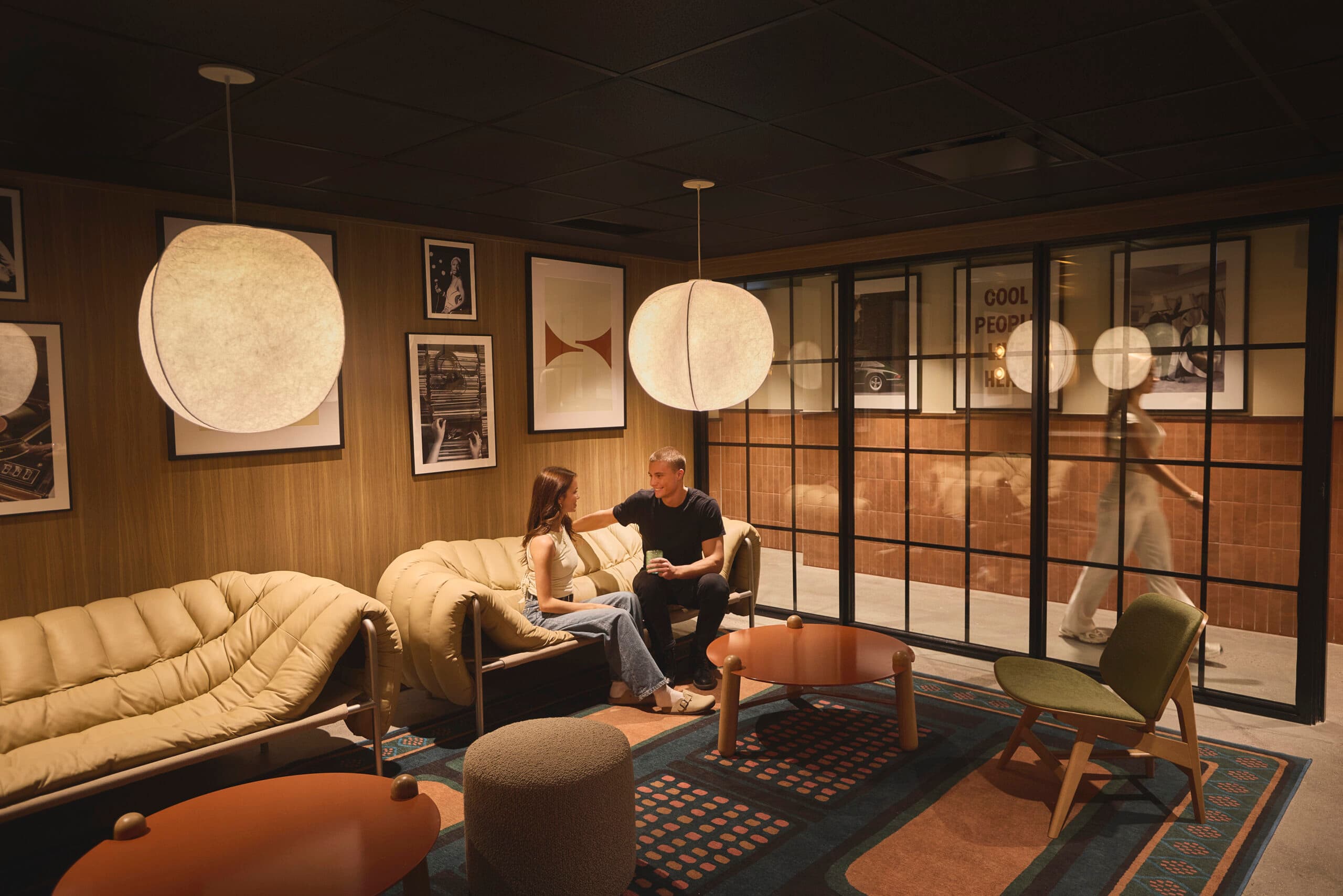 Residents relaxing in the lounge at Alma ByWard Market