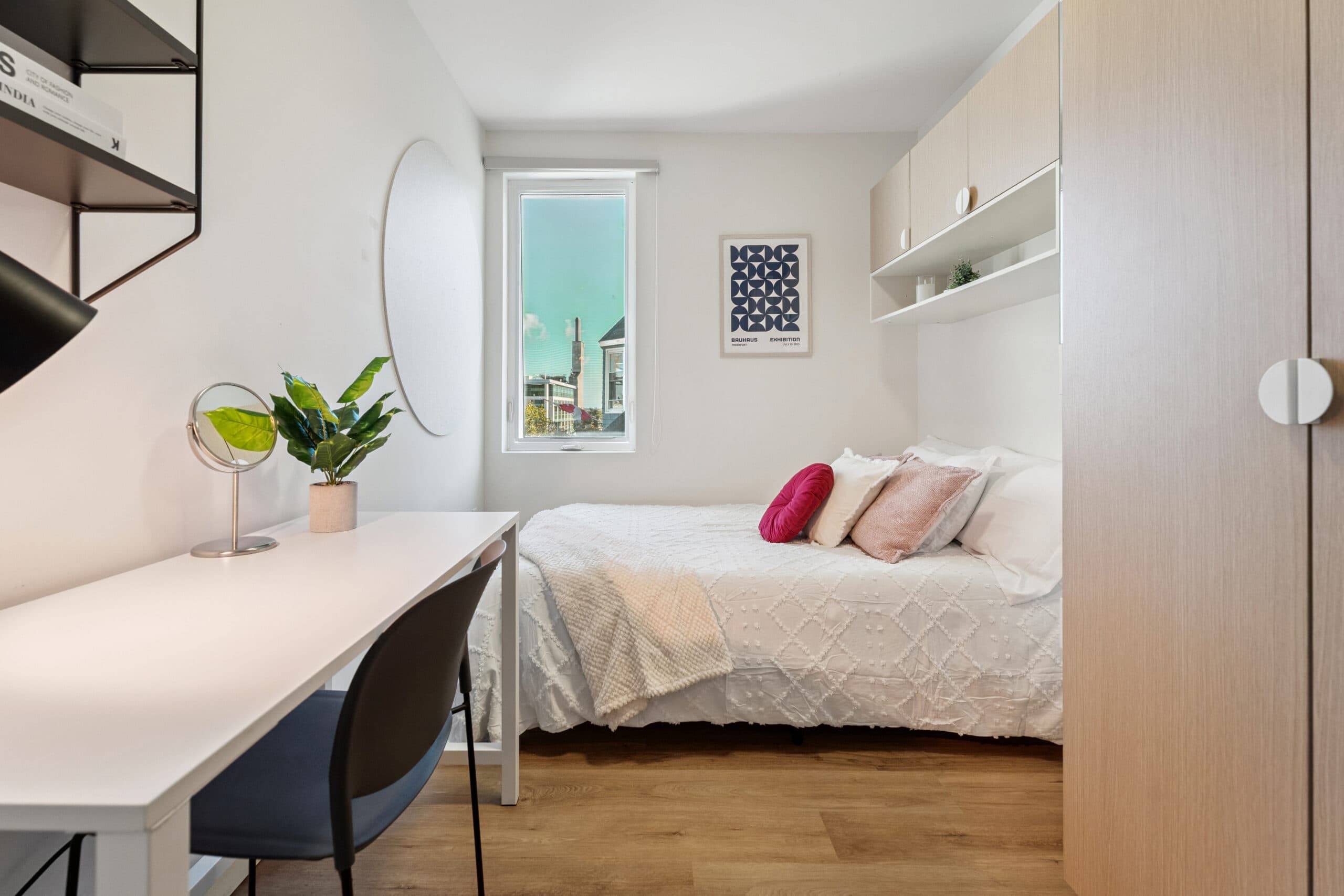 Bedroom with desk and window