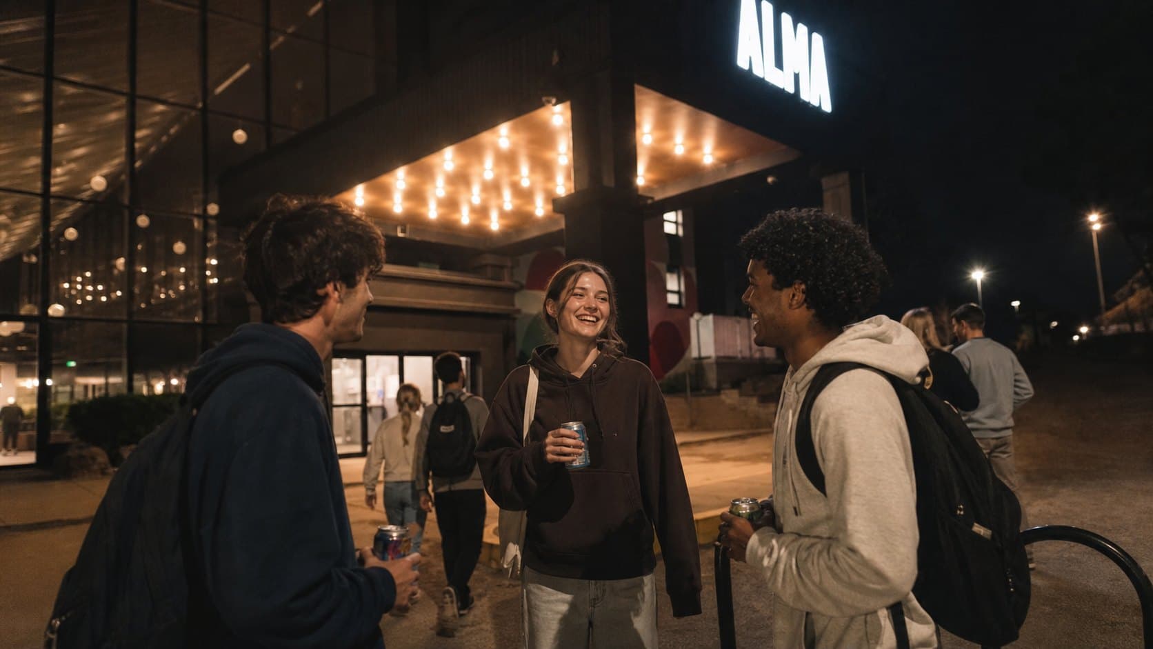Friends at the ALMA Guelph entrance at night