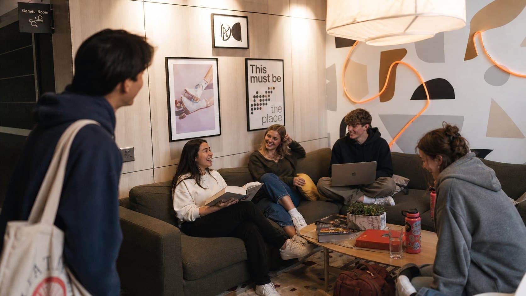 Residents studying together on the lounge sofas at ALMA Oshawa